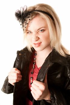 Pretty young woman in a black leather jacket making a face