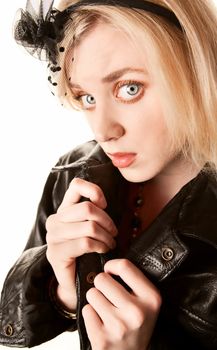 Pretty young woman in a black leather jacket