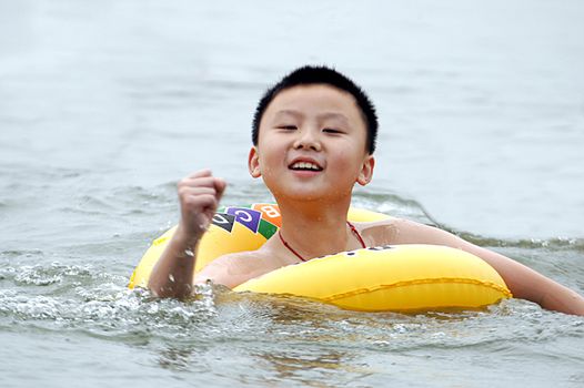 Children swim in the lake