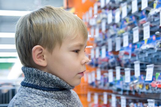 Boy in shop with toys