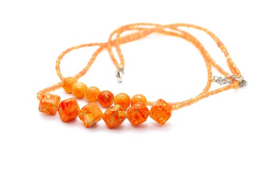 photo of the beautiful orange necklace on white background