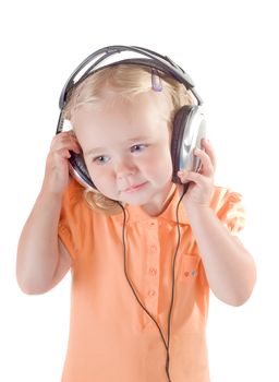 Shot of little girl with headphones in studio