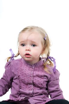 A little cute girl sitting in studio