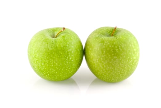 Two granny smith apples isolated on white.
