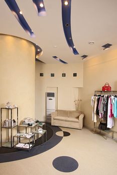 Interior of the big shop of fashionable clothes