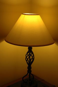 a room decorative lamp casting light and shadows on a wall
