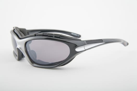 pair of sport sunglasses on light background