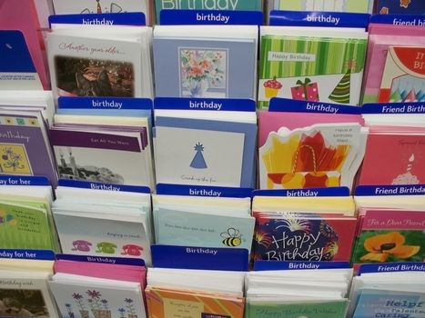 assorted birthday cards display on a card rack