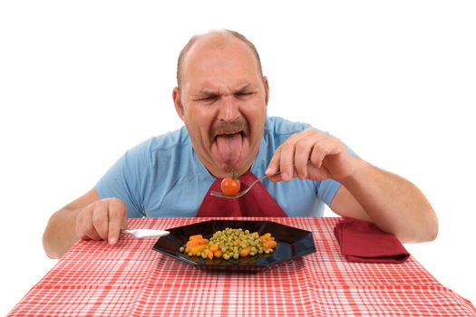 Mature man sticking out his tongue in disgust