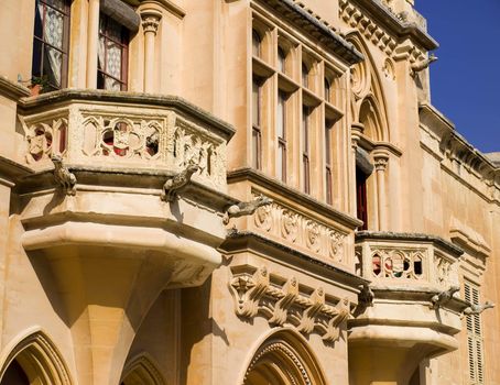 A medieval limestone facade in traditional Gothic style in Mdina on the island of Malta