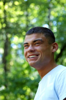 Portrait of a young man in forest