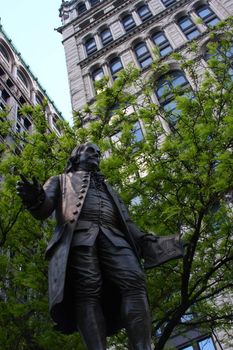 Statue of Benjamin Franklin in outdoor settings. Shot in New York City.