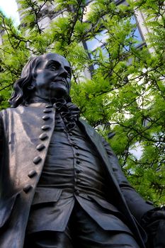 Statue of Benjamin Franklin in outdoor settings. Shot in New York City.