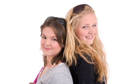 Two cute teenage girls standing side by side
