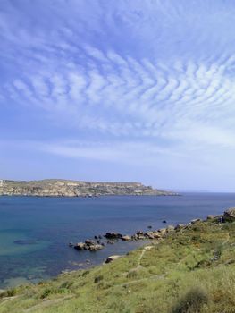 Typical rocky coastline in Malta, punctuated with sheer drops and jagged cliffs