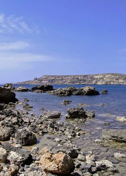 Typical rocky coastline in Malta, punctuated with sheer drops and jagged cliffs