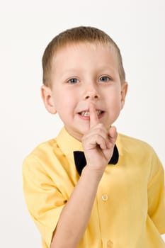 portrait of little boy on the yellow shirt