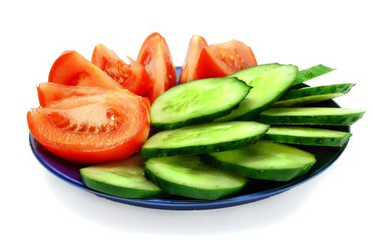 Isolated Slices of Tomato and Cucumber on Plate