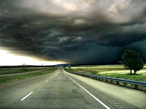 Highway leading into a Storm on the Horizon Background