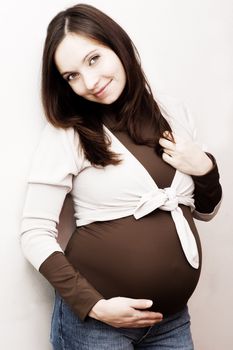 Smiling pregnant woman, third trimester