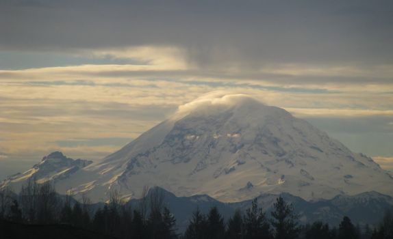 Mt. Rainier set against a beautiful sunrise sky background.