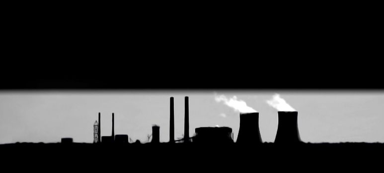 Alternative Green Energy Nuclear Power Plant silhouette with copy space.