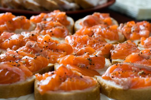 White bread sandwiches with smoked salmon. Shallow DOF.