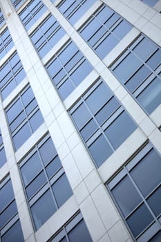 Windows of a skyscraper building downtown Bellevue looking up from the ground level. 