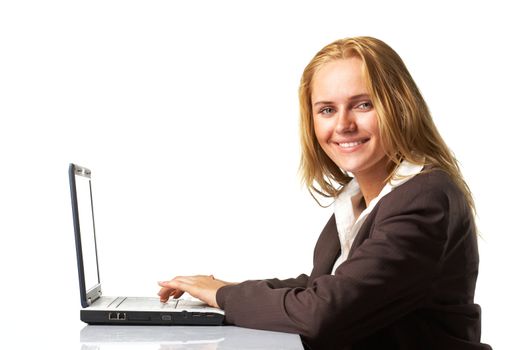 Portrait of a business woman working on a laptop over white background
