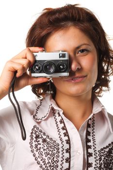 Woman taking a photograph with a classic camera