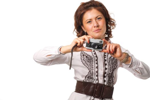 Woman taking a photograph with a classic camera