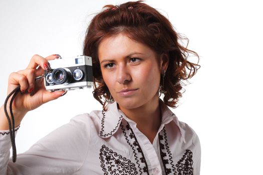 Woman taking a photograph with a classic camera