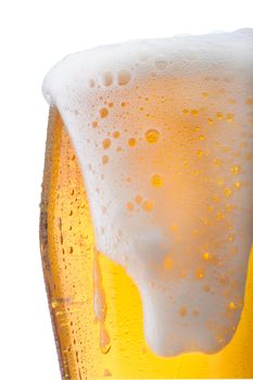 Fresh glass of pils beer with froth and condensed water pearls