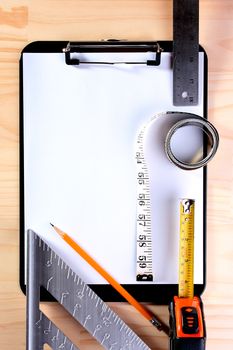 Tools for measurements and a pencil against Blank Clipboard in which it is possible to write results of measurements.