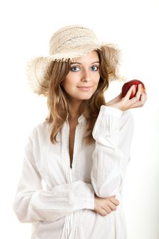 Portrait of a beautiful young woman with a red healthy apple