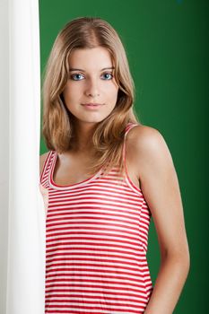 Portrait of fresh and Beautiful young woman over a green background