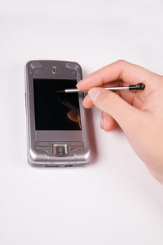 smartphone with businesswoman's hand ready to plan a meeting
