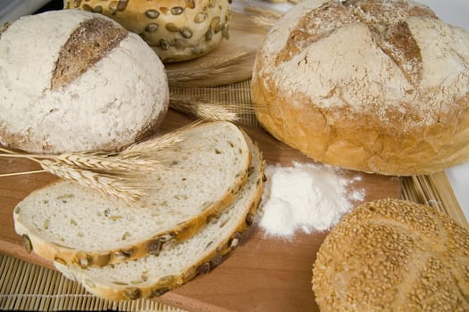 tasty and crispy fresh different kinds of bread with sour and wheat head