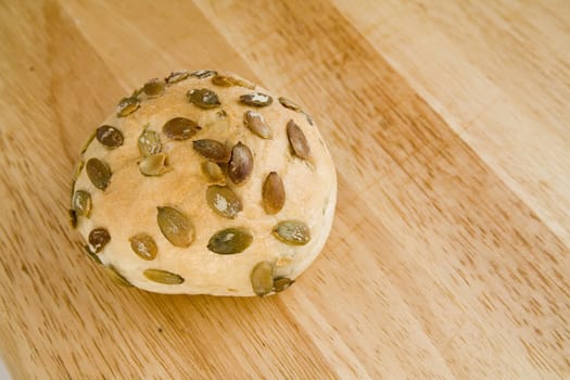 tasty and crispy fresh roll on wooden background