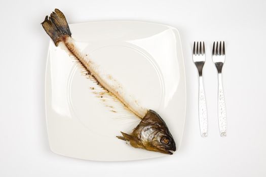 eaten fish with head and tail - symbol of misery