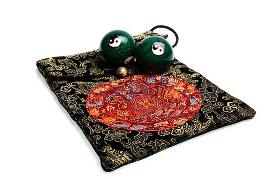 The Chinese balls for meditation with a sack the embroidered east ornament.