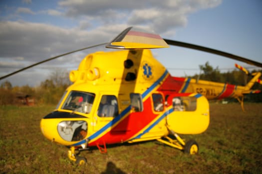 rescue helicopter landed on the grassy field