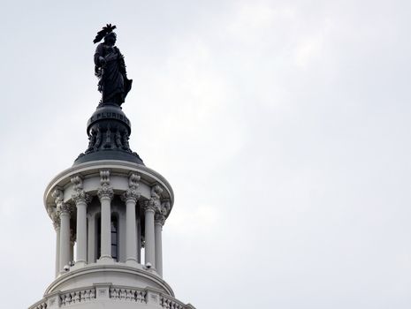 The Statue of Freedom on top of the Capitol Building.