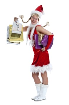 Cute girl in christmas outfit with lots of shopping bags