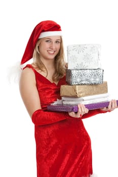Young girl in santa outfit with a pile of presents
