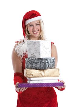 Cute young girl standing with a pile of presents in her hands