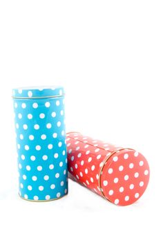 coloful dotted tins isolated on white