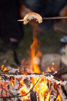 crispy bread over fireplace - typical camping scene