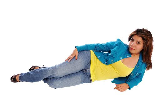 attractive young woman laying on the floor in a colorful sweater set on a white background