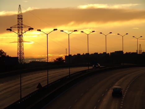 Sunset on the highway. Beautiful, scenic clouds.